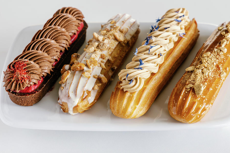 Chocolate, Salted Caramel, Vanilla And Earl Grey Eclairs Photograph by Alla Machutt
