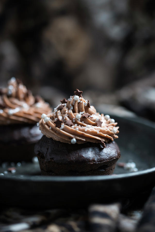 Chocolate Spice Cupcakes With Nougat Frosting And Christmas Sugar Decorations Photograph by Kati Neudert