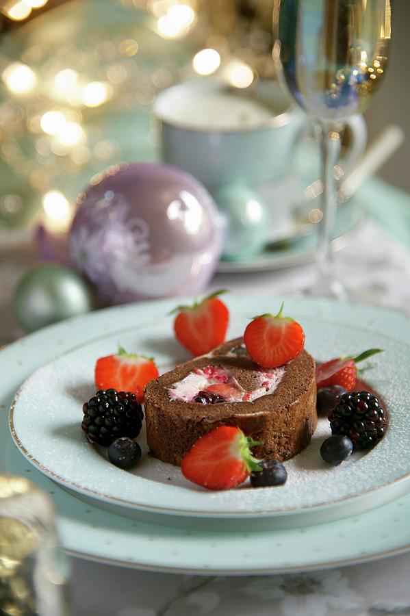 Chocolate Swiss Roll With Berries For Christmas Photograph by Heinze, Winfried