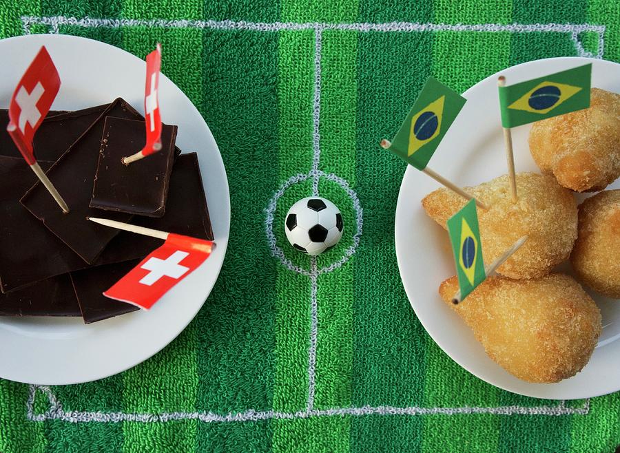 Chocolate switzerland And Salgadinhos brazil With Football-themed Decoration Photograph by Schindler, Martina