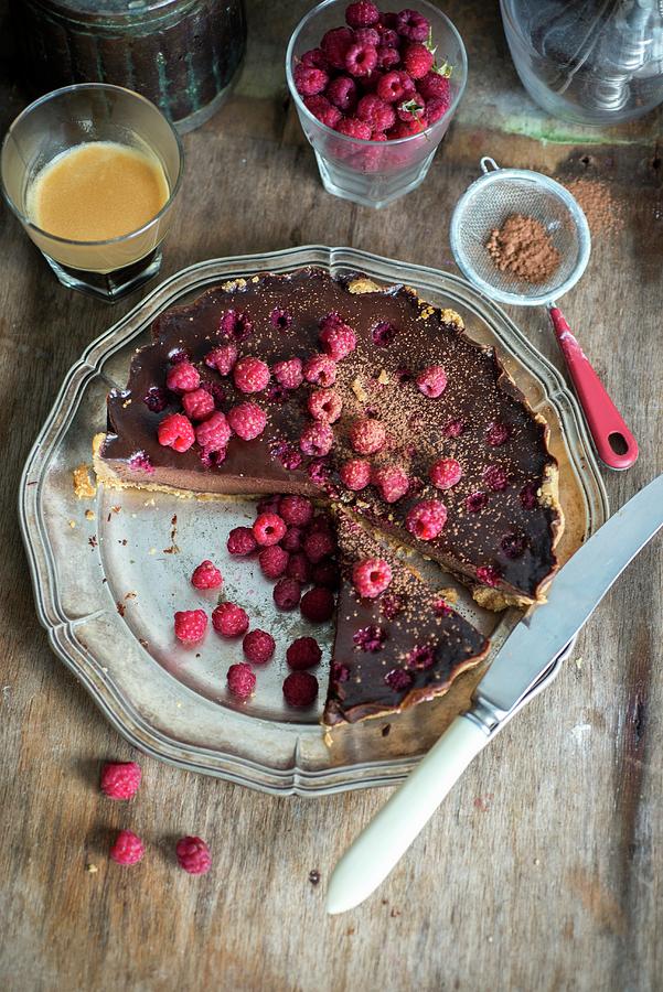Chocolate Tart With Chocolate Filling And Raspberries, Decorated With Fresh Raspberries, Sliced Photograph by Irina Meliukh