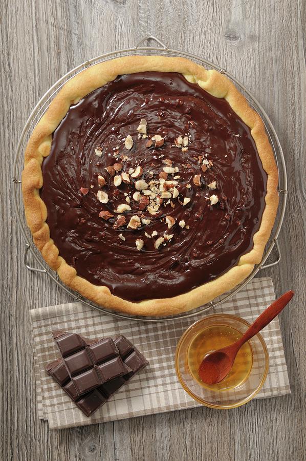 Chocolate Tart With Hazelnuts And Honey Photograph by Jean-christophe Riou