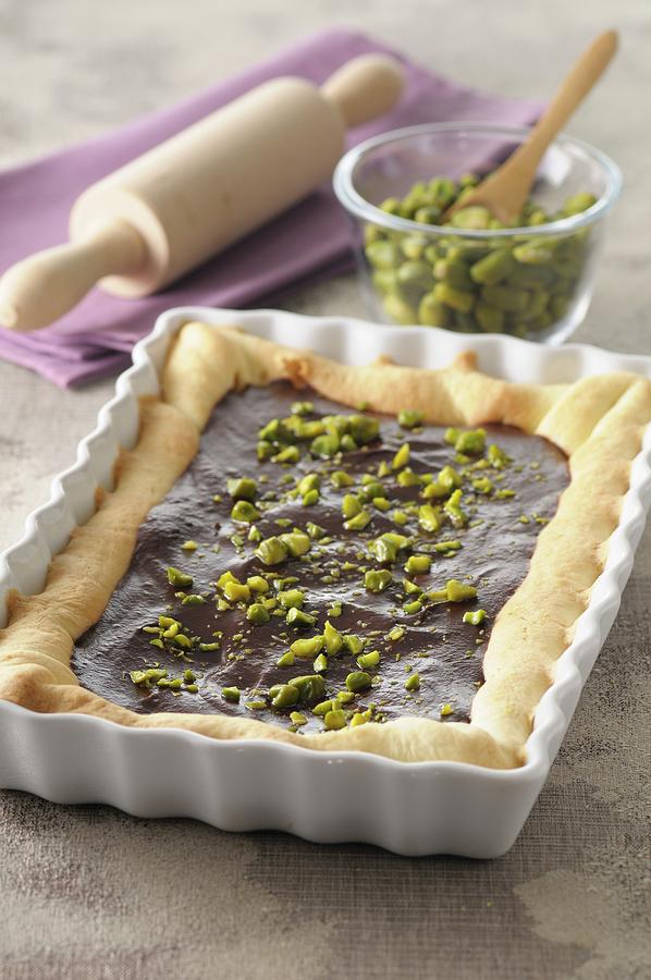 Chocolate Tart With Pistachios In A Square-shaped Baking Dish Photograph by Jean-christophe Riou