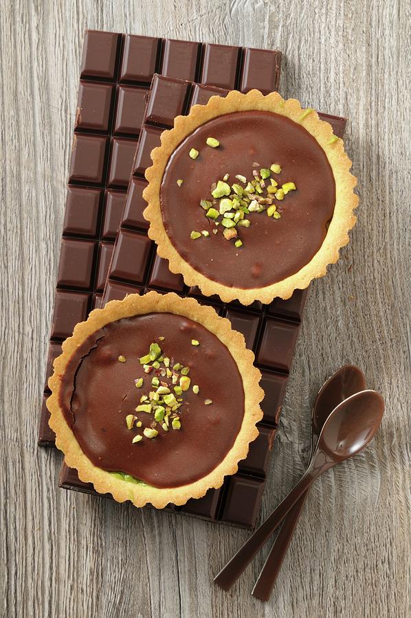 Chocolate Tartlets With Pistachio Nuts Photograph by Jean-christophe Riou