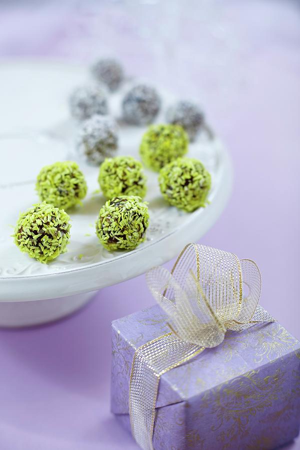 Chocolate Truffles With Coconut Shawings On White Plate And Gift Box Photograph by Zemgalietis, Maris