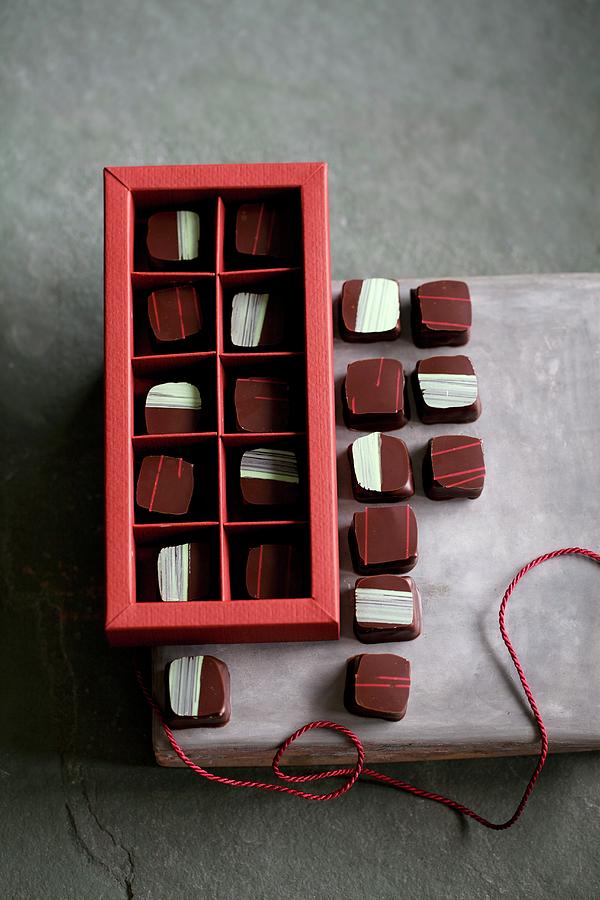 Chocolates Filled With Rosemary And Pine Nuts And With Raspberry And Verveine Photograph by Fotos Mit Geschmack