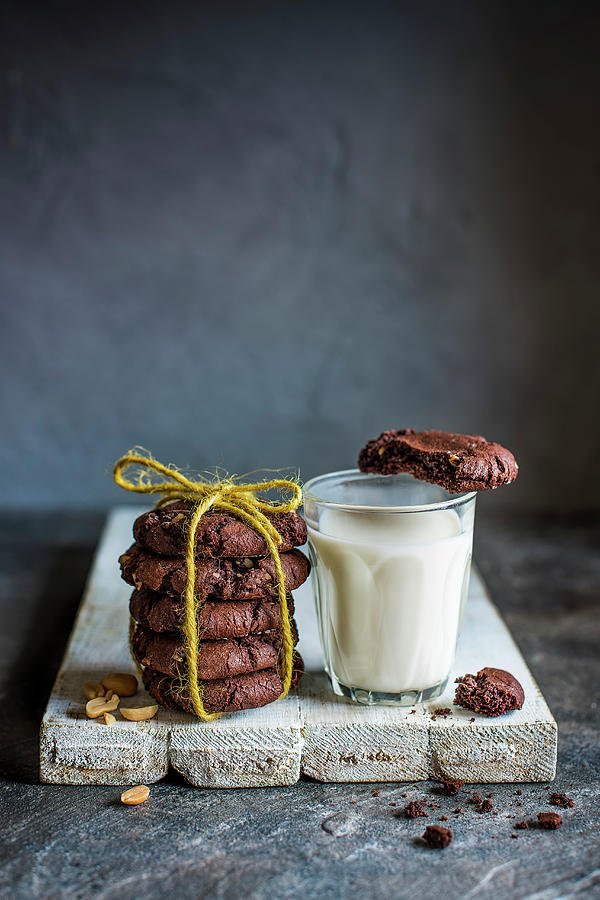 Chocoloate And Peanut Cookies With A Glass Of Milk Photograph by Magdalena Hendey