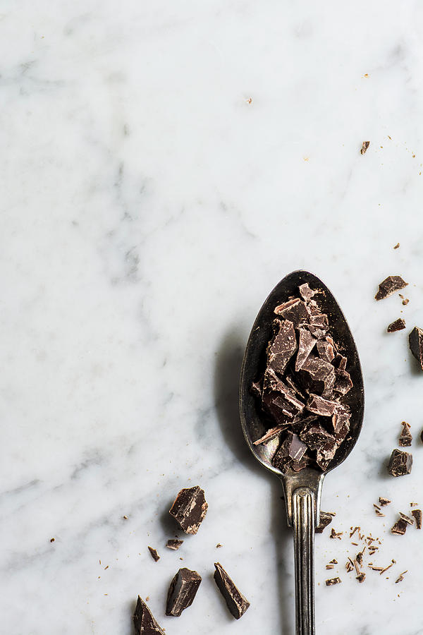 Chopped Dark Chocolate On A Spoon Photograph by Mateusz Siuta