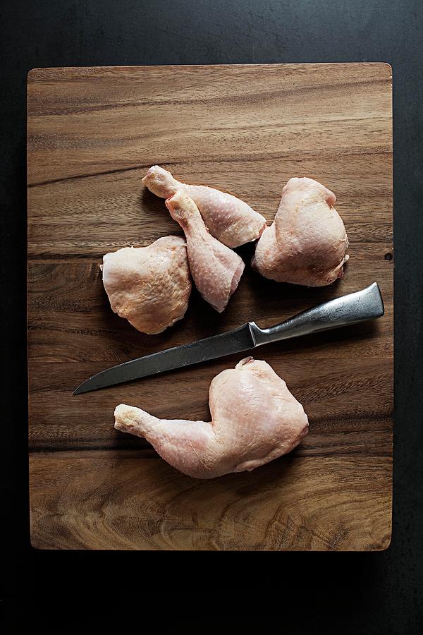 Chopped Raw Chicken Legs Photograph by Jalag / Markus Bassler