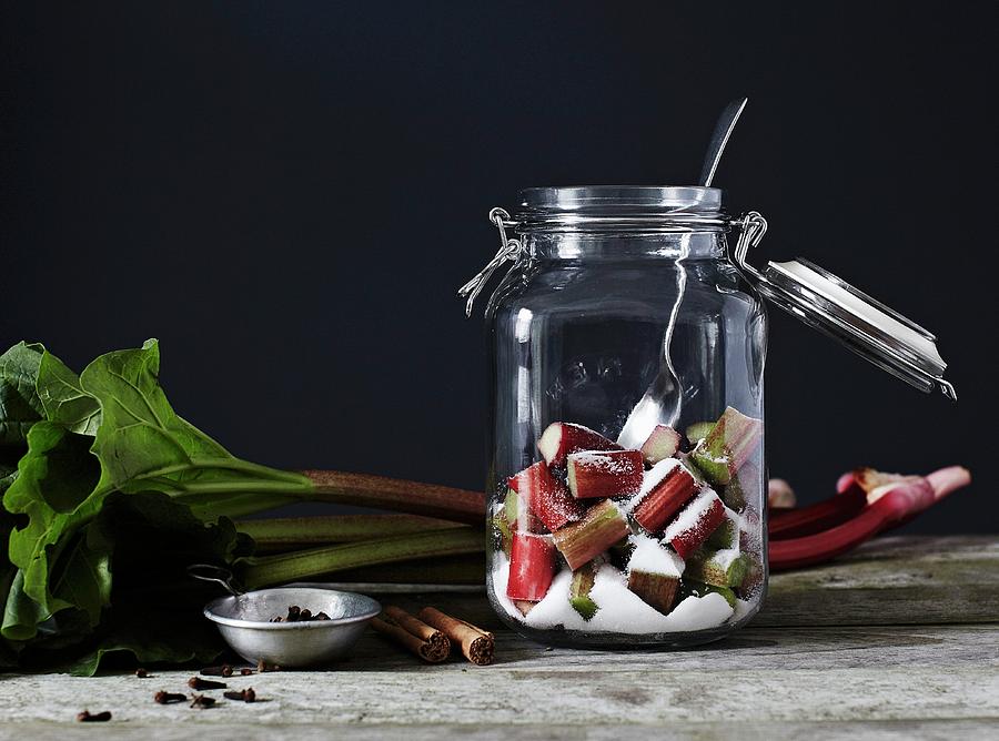Chopped Rhubarb And Sugar, In An Open Kilner Jar With A Metal Spoon Photograph by Will Shaddock Photography