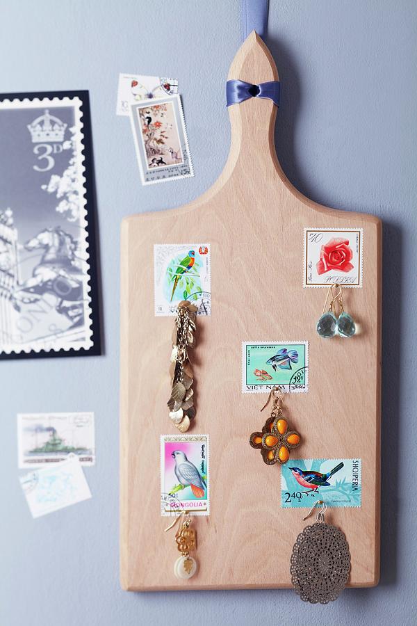Chopping Board Decorated With Postage Stamps And Used As A Jewellery Rack Photograph by Franziska Taube