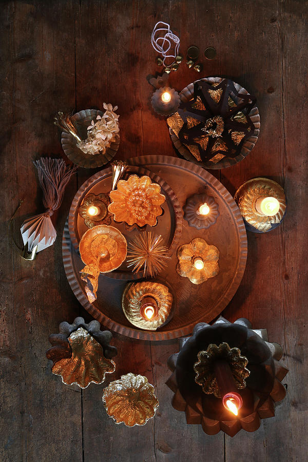 Christmas Arrangement Of Gilt Candlesticks And Baking Tins Photograph by Regina Hippel