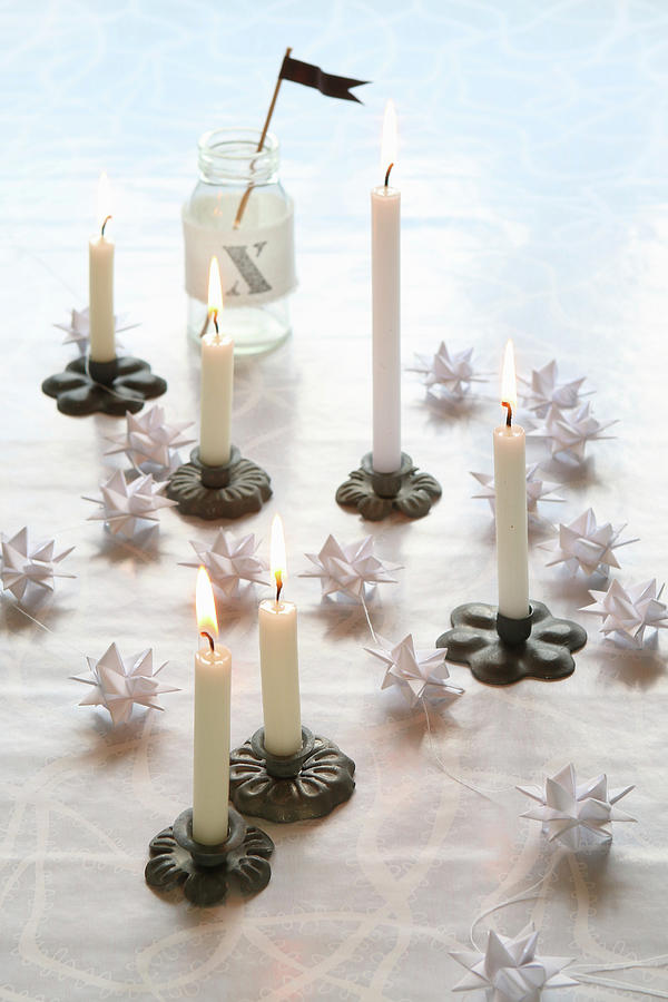 Christmas Arrangement Of Miniature Candlesticks And White Origami Stars Photograph by Regina Hippel