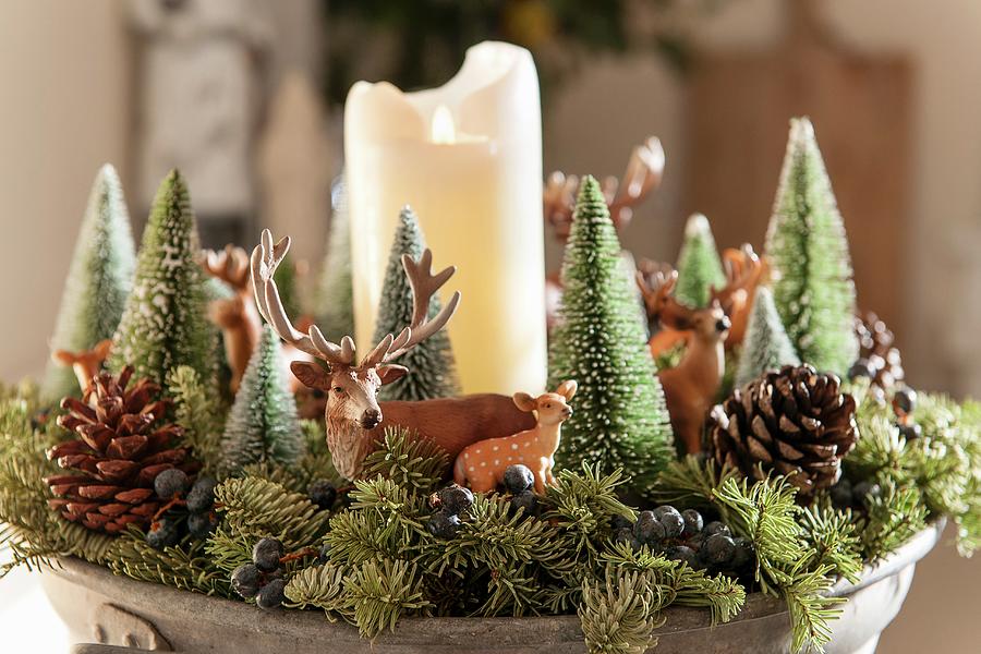 Christmas Arrangement Of Small Fir Trees, Animal Figurines And White Pillar Candle Photograph by Moog & Van Deelen