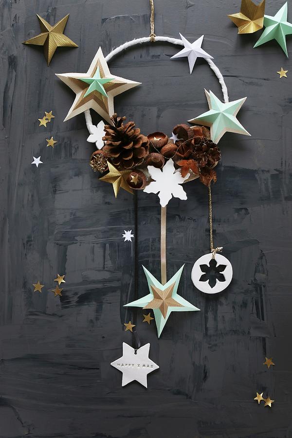 Christmas Arrangement Of Stars And Pine Cones On Ring Photograph by Regina Hippel