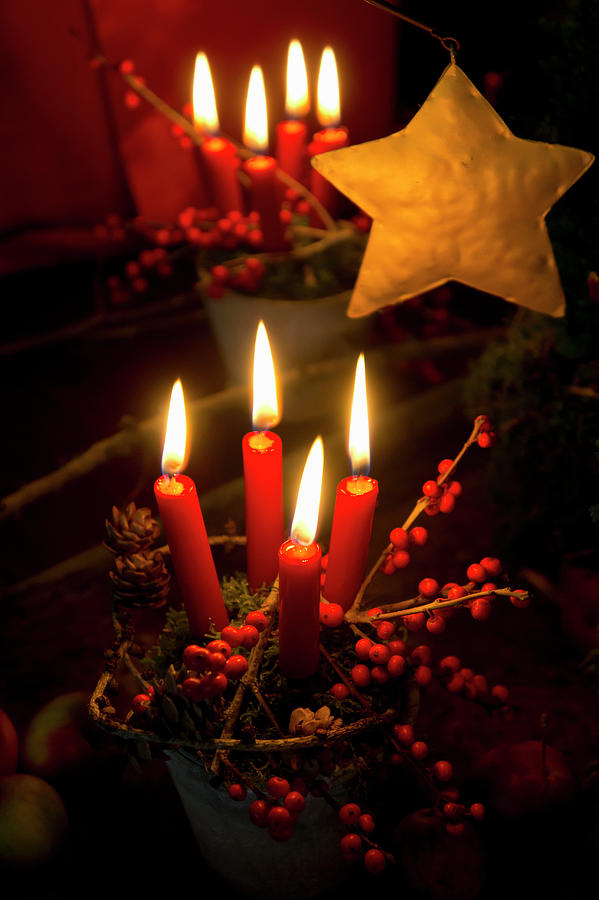 Christmas Arrangement Of Terracotta Pot, Moss And Four Candles, Photograph by Martina Schindler