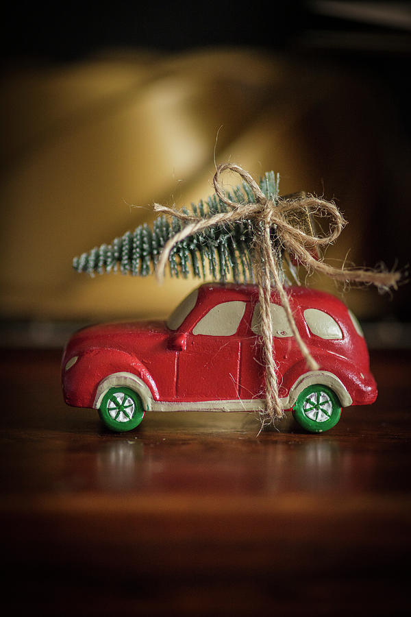 Christmas Arrangement Of Toy Car With Christmas Tree On Roof Photograph by Katrin Winner