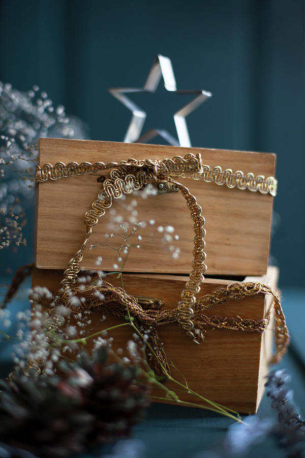 Christmas Arrangement Of Wooden Drawers With Golden Ribbons Photograph by Alicja Koll