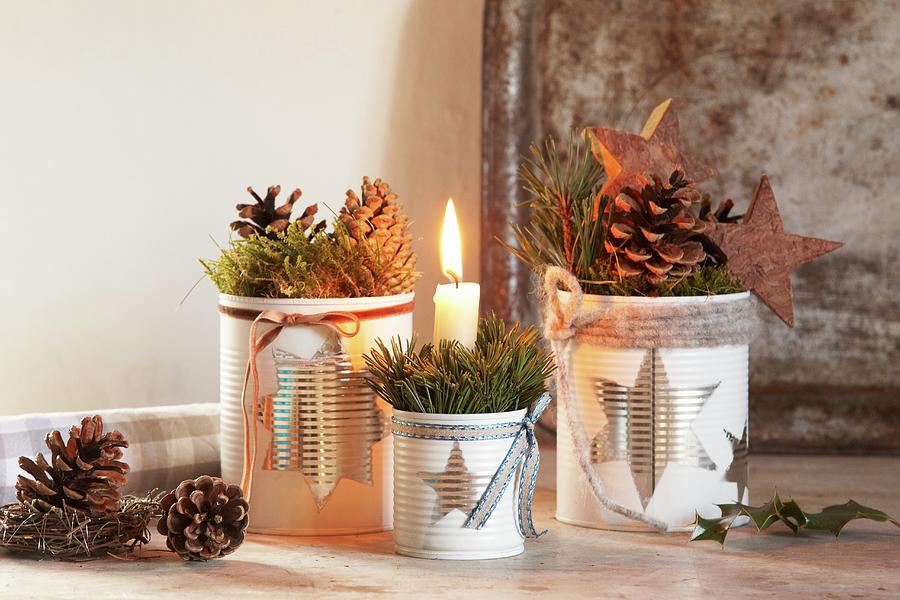 Christmas Arrangement With Lit Candle In Tin Can With Star Motif Photograph by Heidi Frhlich