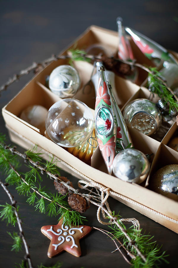 Christmas Baubles In Box, Larch Twig And Star-shaped Biscuit Photograph by Alicja Koll