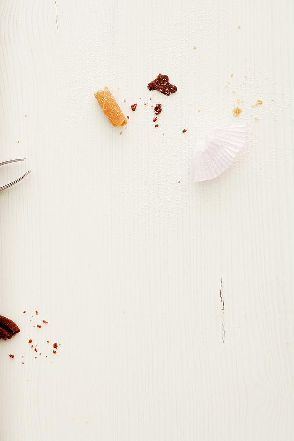 Christmas Biscuit Crumbs And Paper Cases Photograph by Michael Wissing