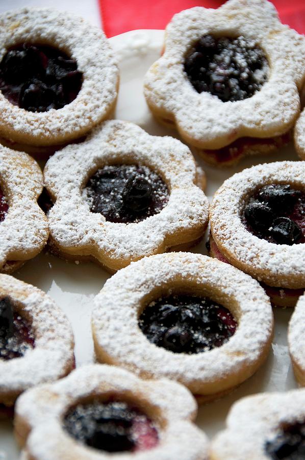Christmas Biscuits With Blackberry Jam Photograph by Nele Siebel