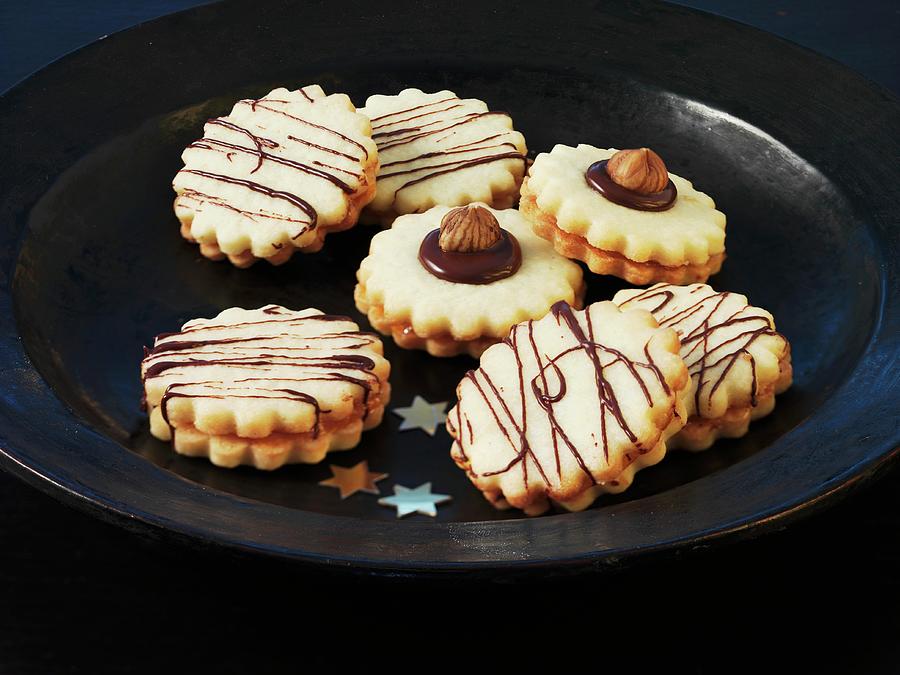 Christmas Biscuits With Chocolate Stripes And Hazelnuts Photograph by Kng, Ruth
