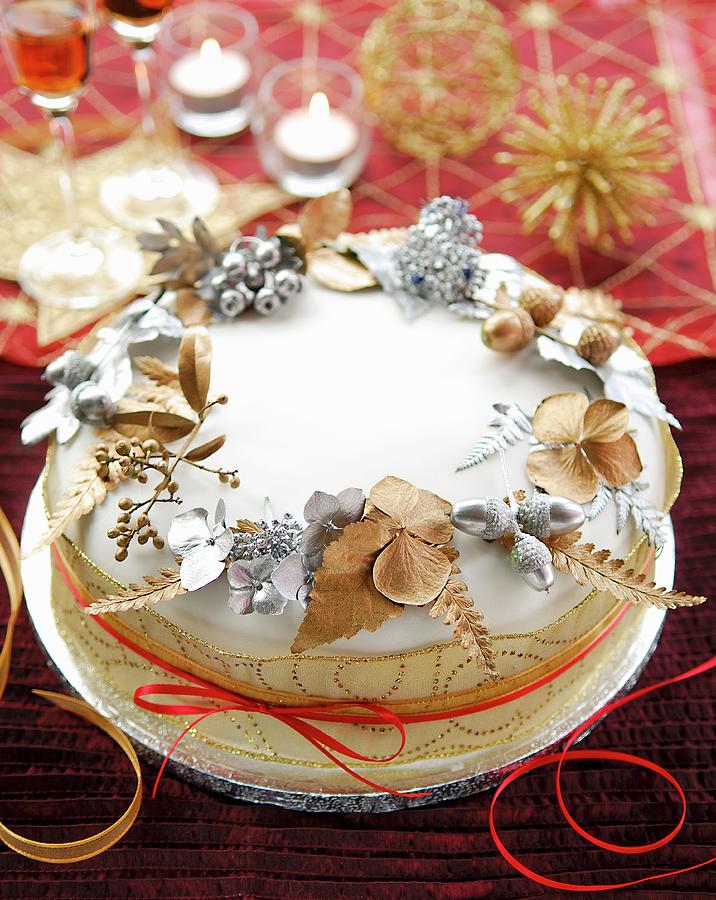 Christmas Cake Decorated With Painted Leaves Photograph by Jonathan Short