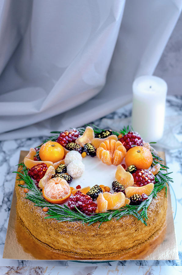 Christmas Cake With Mandarins Photograph by Gorobina