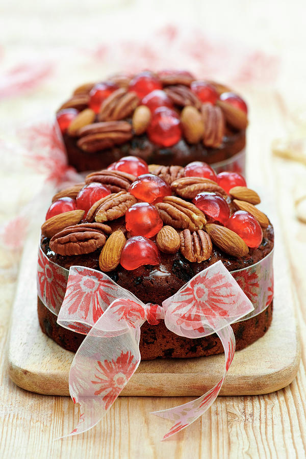 Christmas Cakes Decorated With Ribbon Photograph by Jonathan Short