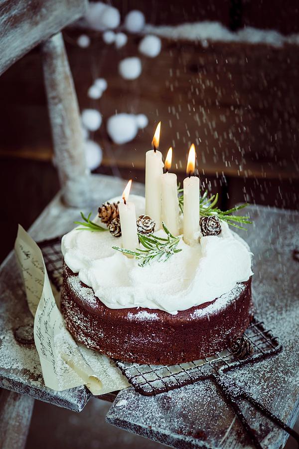 Christmas Chocolate Cake With Lit Candles Photograph by Eising Studio
