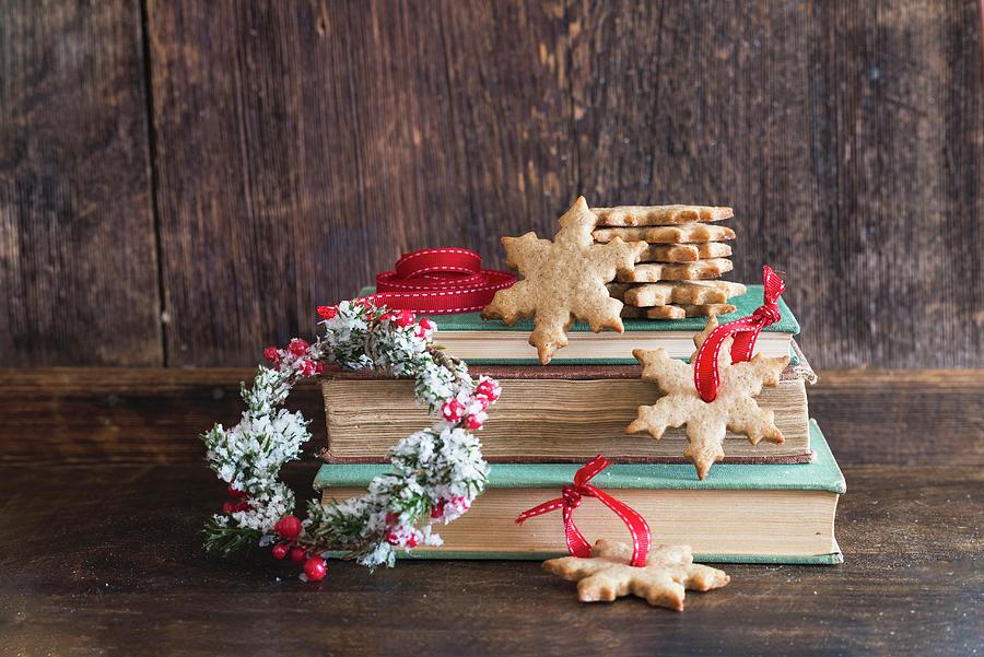 Christmas Cookies On Old Books Photograph by Veronika Studer