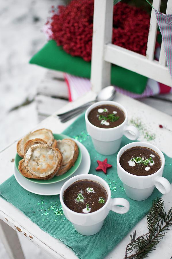 Christmas Cream Soup Made With Porcini Mushrooms, Topped With Sour Cream And Chopped Fresch Lovage Photograph by Kachel Katarzyna