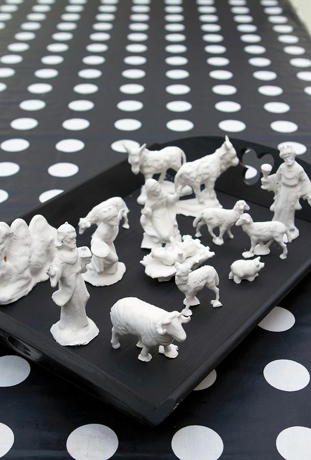 Christmas Crib Figurines Dipped In Plaster On Black Tray Photograph by Olga Serrarens