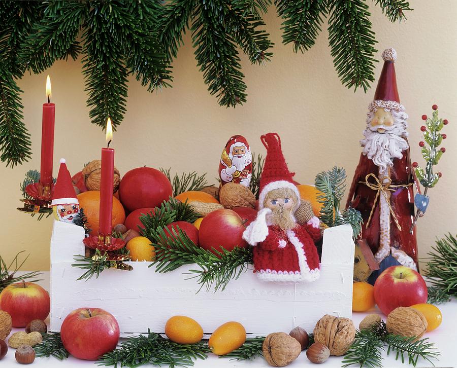 Christmas Decoration: Fruit, Nuts, Fir Branches & Father Xmases Photograph by Strauss, Friedrich