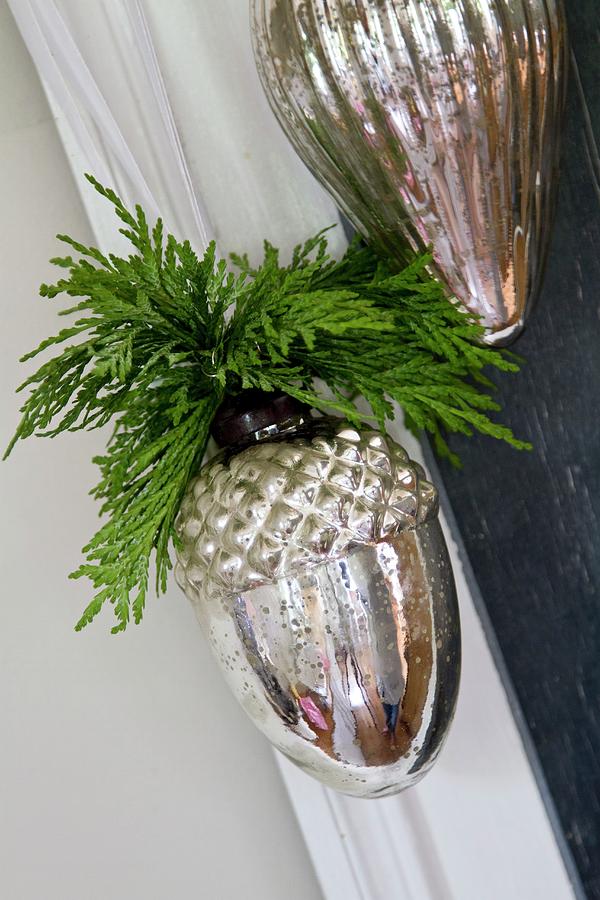Christmas Decoration Of Silver Acorns With Cypress Sprigs Photograph by Catja Vedder