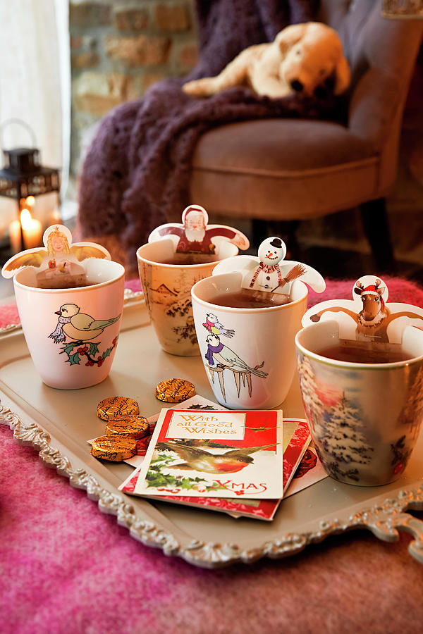 Christmas Figurines With Tea Bags And Cups On Tray Photograph by Jalag / Olaf Szczepaniak