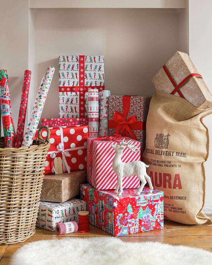 Christmas Gifts Wrapped In Red-patterned Paper Photograph by Winfried Heinze