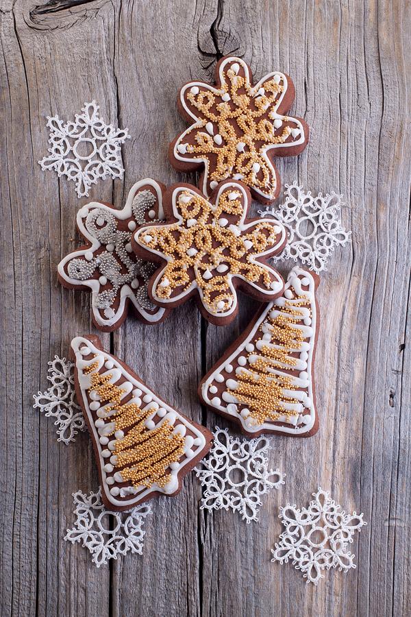 Christmas Gingerbread Biscuits in The Shape Of Stars And Bells On A Wooden Surface Photograph by Wawrzyniak.asia
