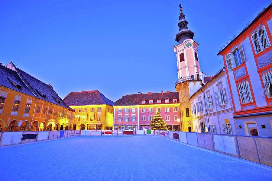 Christmas ice skating ring in Bad Radkersburg evening view Photograph by Brch Photography