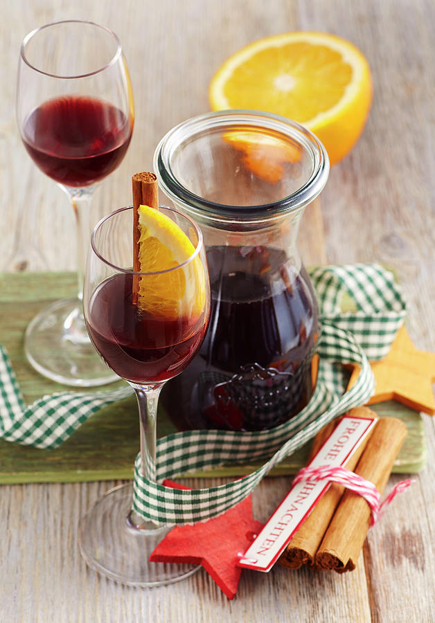 Christmas Mulled Wine Liqueur With Orange, Cinnamon And Vodka Photograph by Teubner Foodfoto