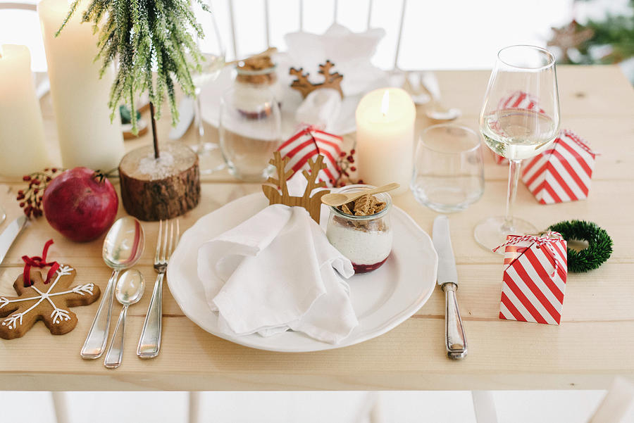Christmas Place Setting With Gingerbread Mousse In Glass Bowl And Guest Favours In Red-and-white Striped Boxes Photograph by Katja Heil