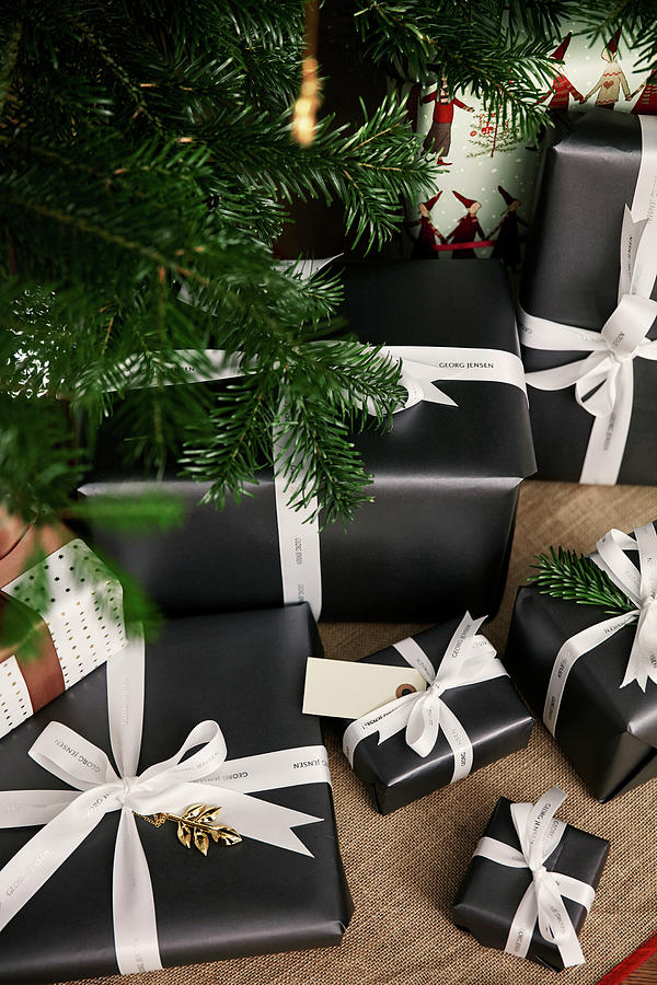 Christmas Presents Wrapped In Black Paper With White Ribbons Photograph by Birgitta Wolfgang Bjornvad