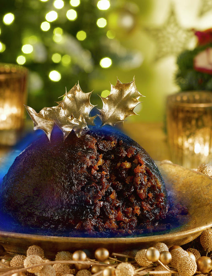 Christmas Pudding With Flaming Brandy Photograph by Jonathan Pollock