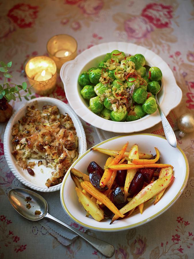 Christmas Side Dishes On An Atmospheric Christmas Table Photograph by Myles New
