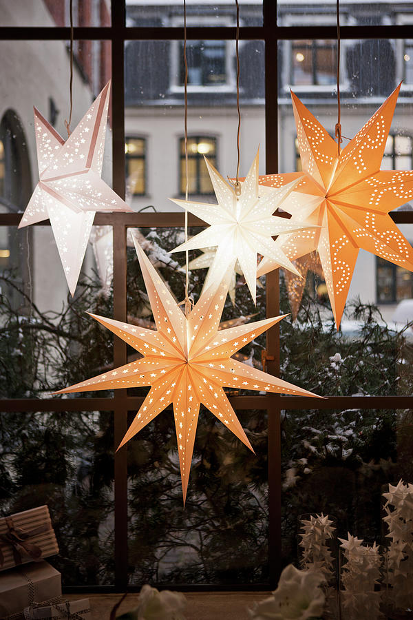 Christmas Stars Arranged In Window Photograph by Lykke Foged & Morten Holtum