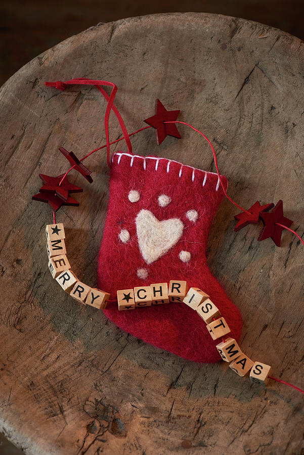 Christmas Stocking And Festive Greeting Made From Wooden Letters Photograph by Inge Ofenstein