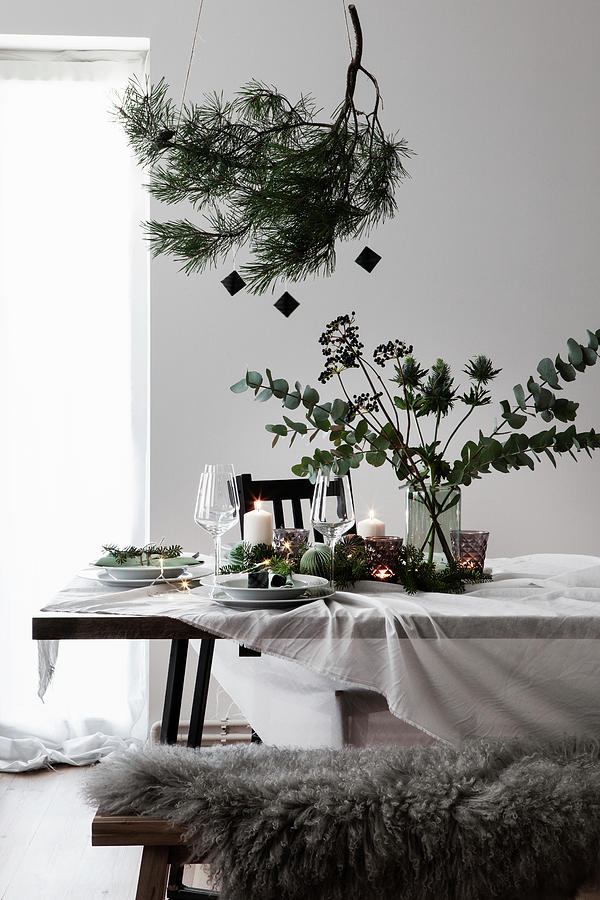 Christmas Table Decoration With A Pine Branch And A Bouquet Of Eucalyptus And Eryngo Photograph by Hej.hem Interior