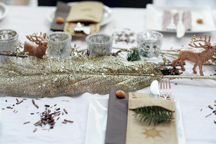 Christmas Table Decorations: Leaf Covered In Gold Glitter, Stag Ornament And Silver Tealight Holders Photograph by Alexandra Feitsch