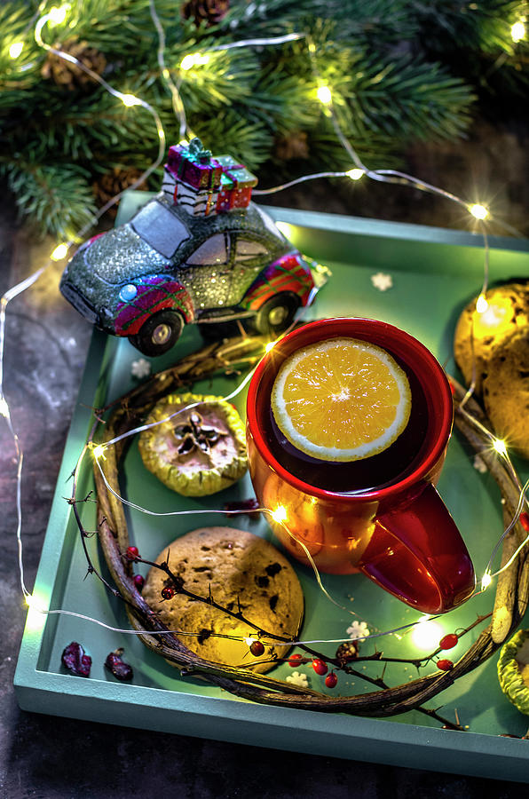 Christmas Tea With Orange And Biscuits With Chocolate On A Tray Photograph by Gorobina